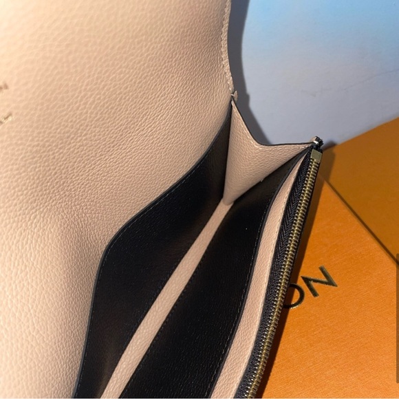 Authentic Louis Vuitton Emilie Monogram Empreinte Leather Wallet in black - Picture 3 of 9